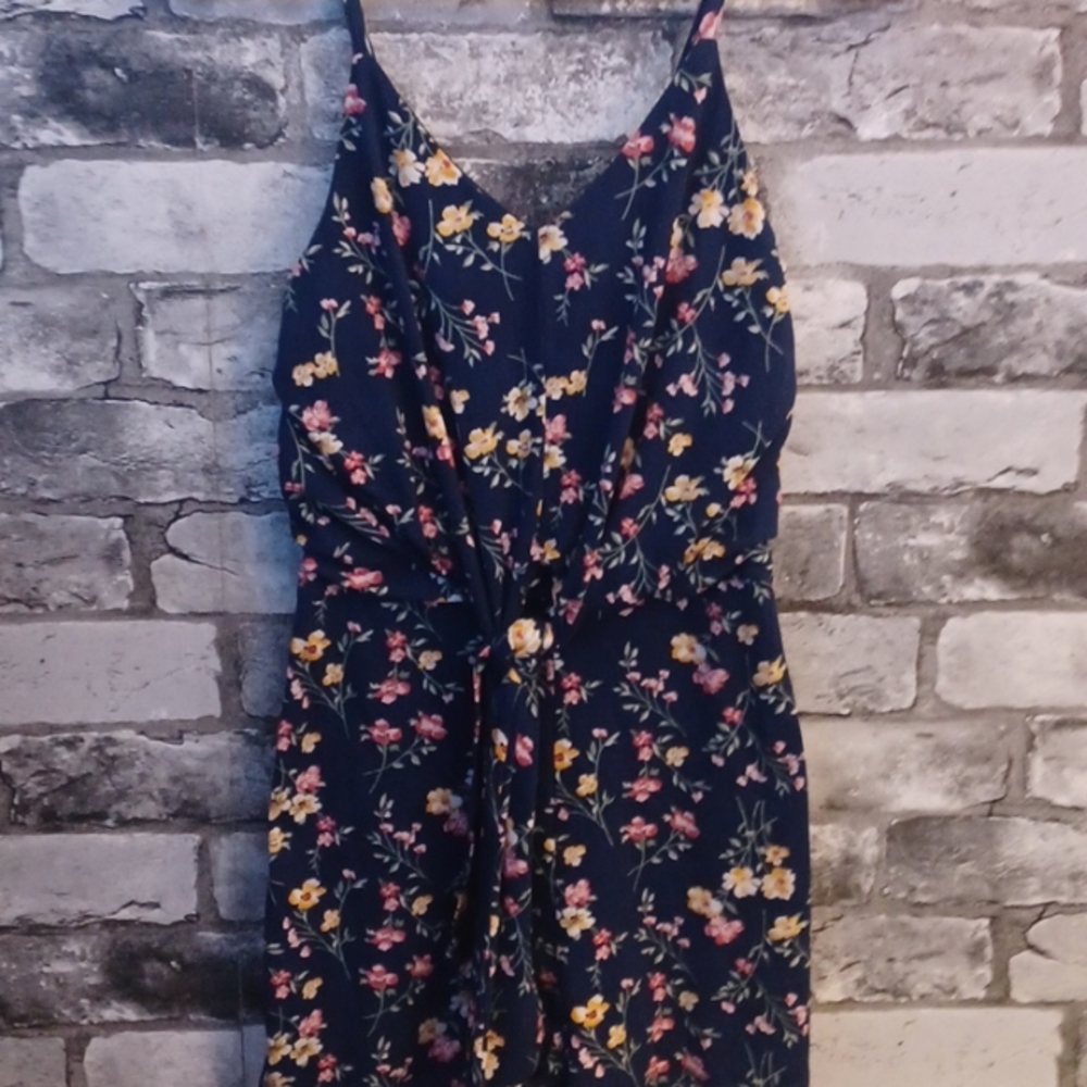 This is a xs romper from the brand called "No Boundaries". Color is navy blue